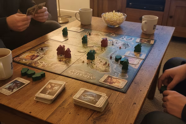 Two-player board game set up on a customer's coffee table